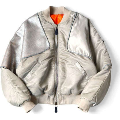 Silver bomber jacket with orange lining on a white background