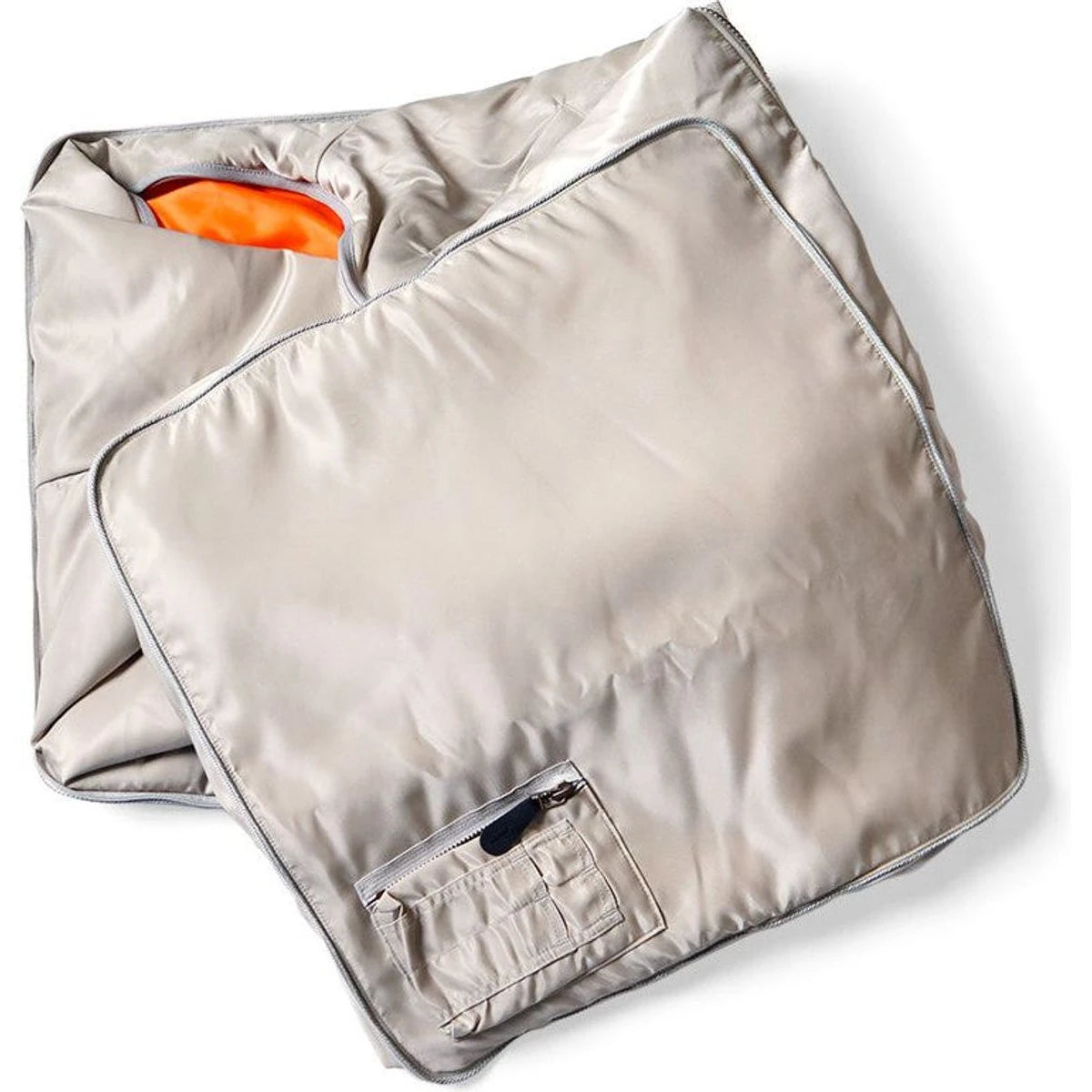 Folded metallic silver blanket on a white background