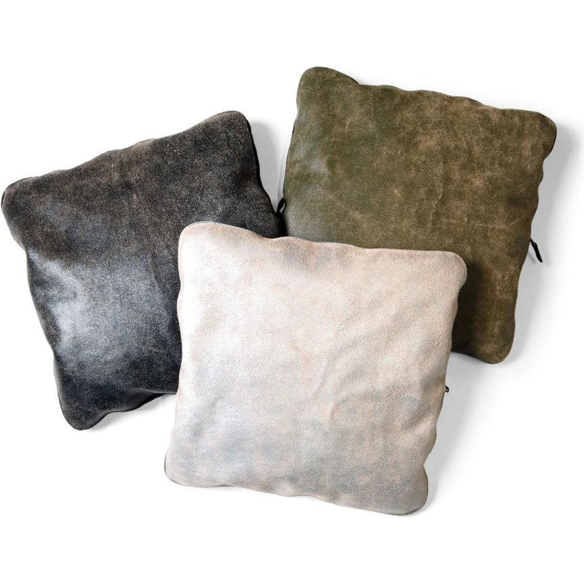 Three textured pillows in gray, green, and beige on a white background