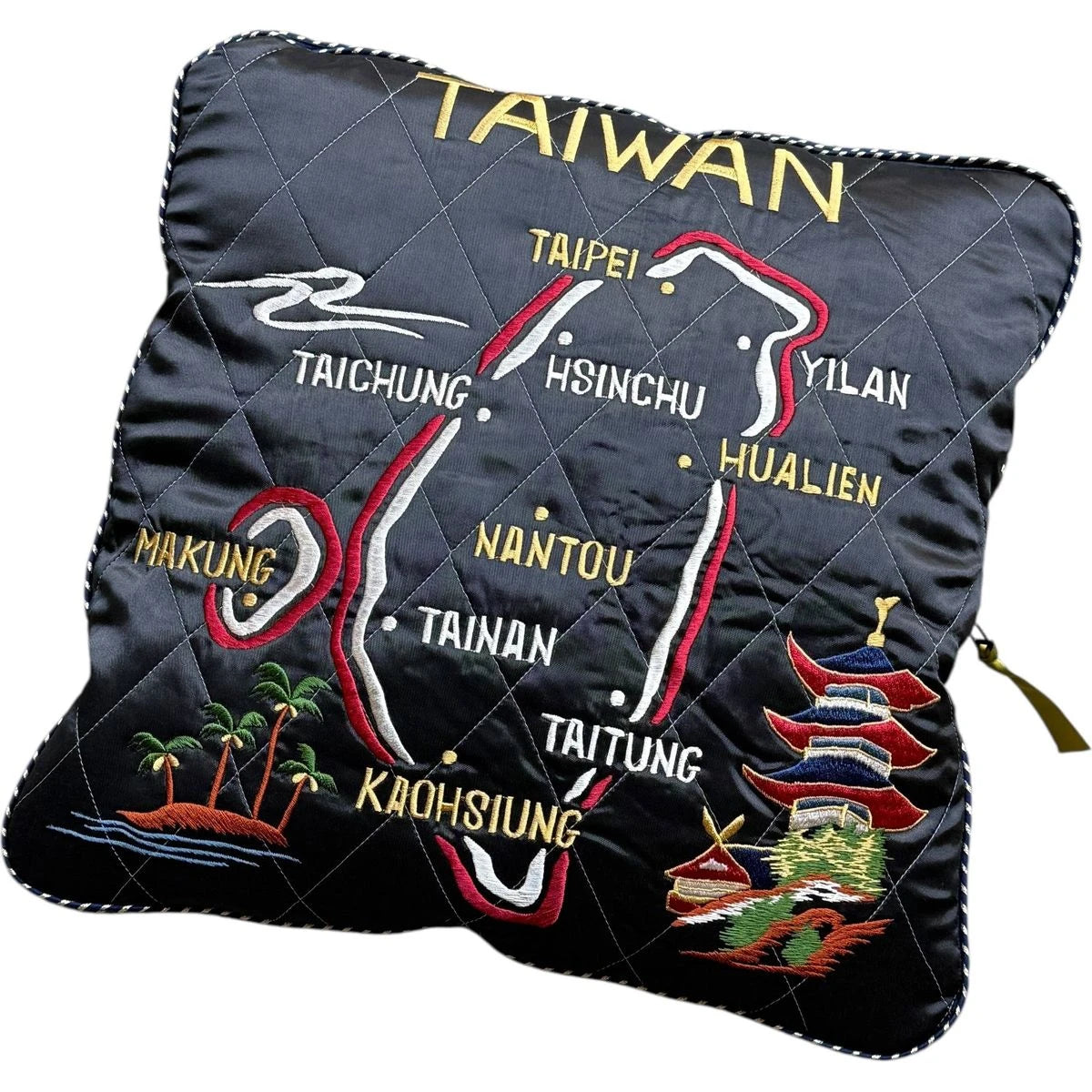 Pillow with embroidered map of Taiwan and cities on a white background